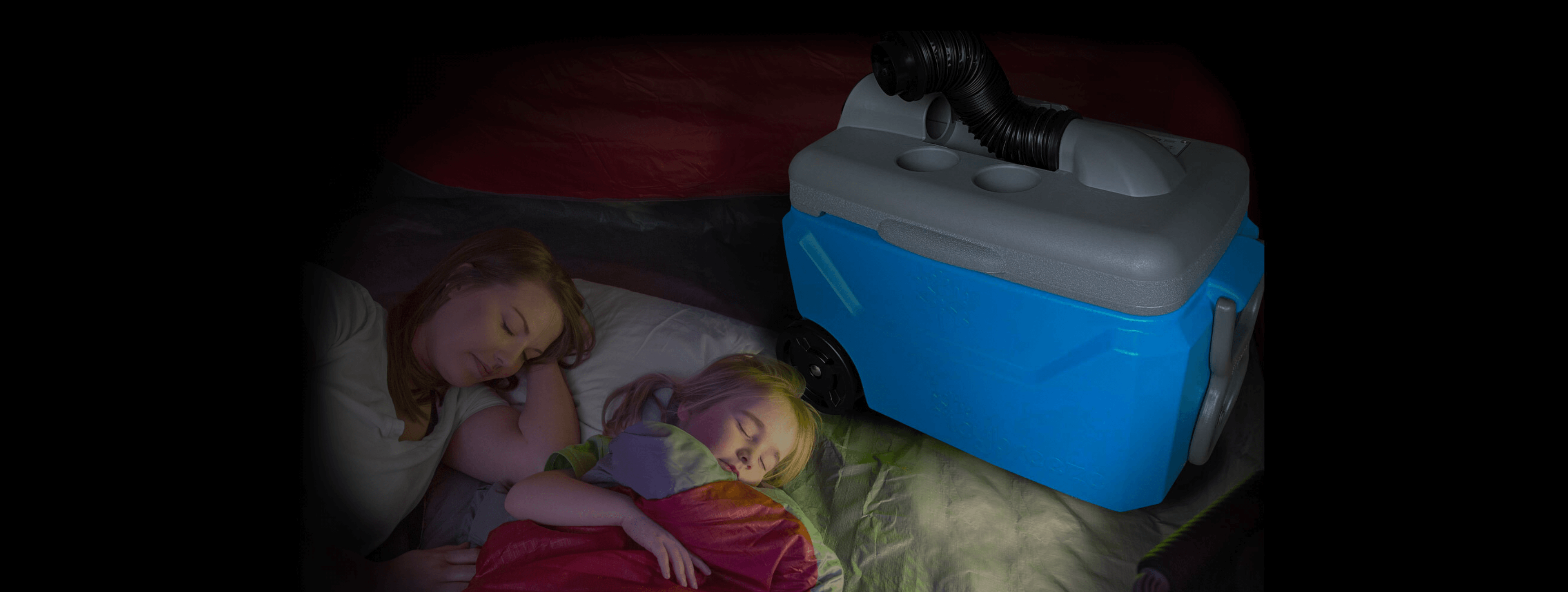 Mother and daughter sleeping in a tent next to an IcyBreeze cooler